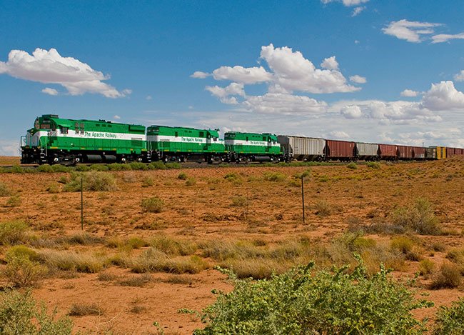 A train passing through a rural area in America